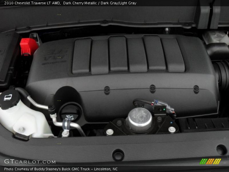 Dark Cherry Metallic / Dark Gray/Light Gray 2010 Chevrolet Traverse LT AWD