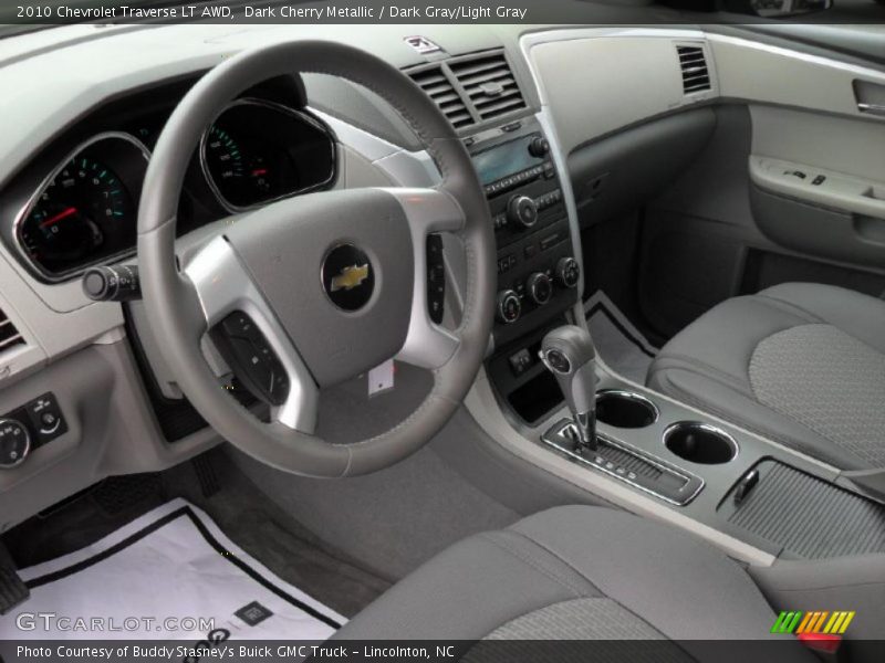 Dark Cherry Metallic / Dark Gray/Light Gray 2010 Chevrolet Traverse LT AWD