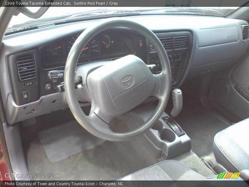 Sunfire Red Pearl / Gray 1999 Toyota Tacoma Extended Cab