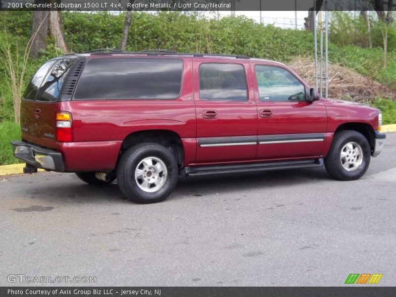 Redfire Metallic / Light Gray/Neutral 2001 Chevrolet Suburban 1500 LT 4x4