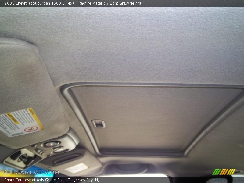 Redfire Metallic / Light Gray/Neutral 2001 Chevrolet Suburban 1500 LT 4x4