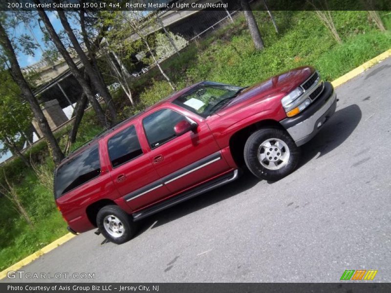 Redfire Metallic / Light Gray/Neutral 2001 Chevrolet Suburban 1500 LT 4x4