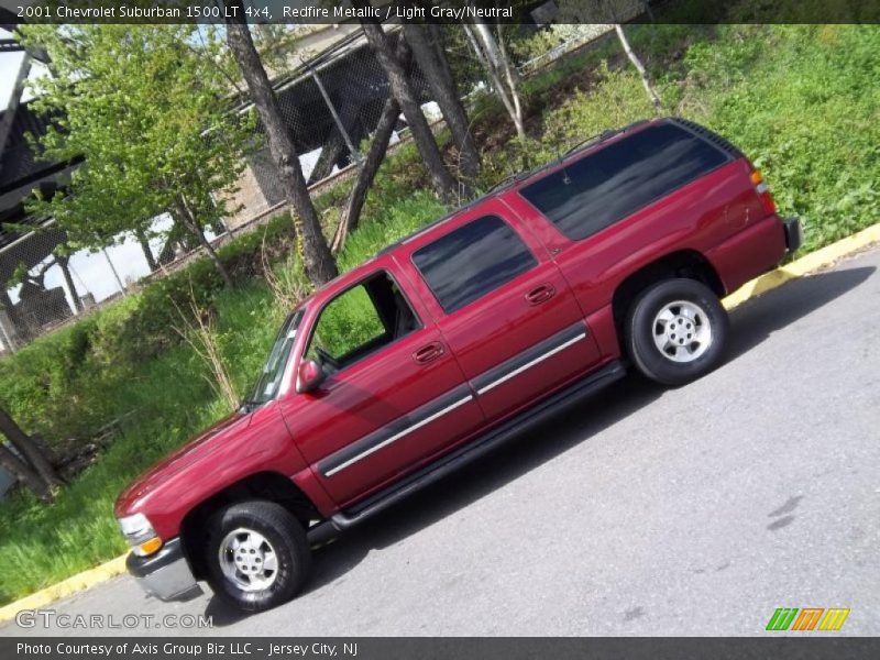 Redfire Metallic / Light Gray/Neutral 2001 Chevrolet Suburban 1500 LT 4x4