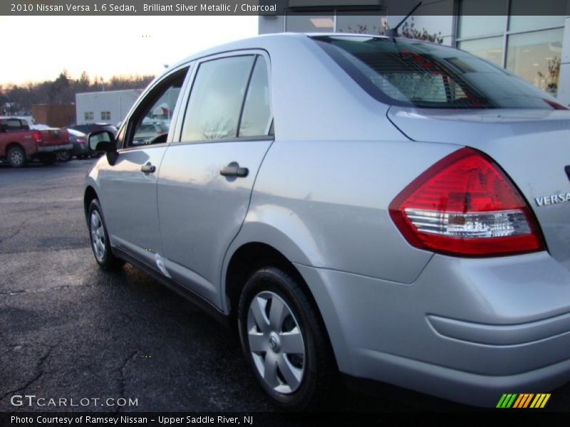 Brilliant Silver Metallic / Charcoal 2010 Nissan Versa 1.6 Sedan