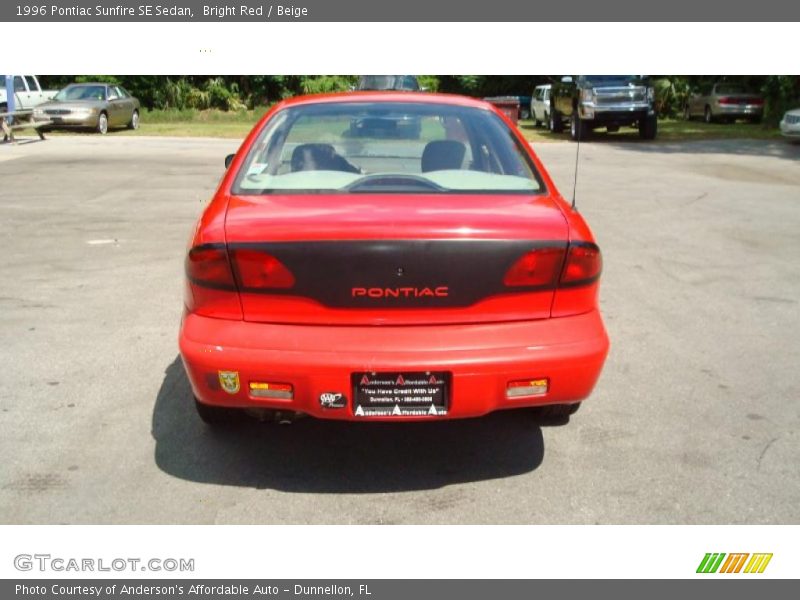 Bright Red / Beige 1996 Pontiac Sunfire SE Sedan