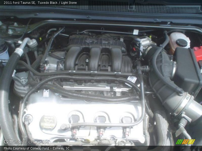 Tuxedo Black / Light Stone 2011 Ford Taurus SE