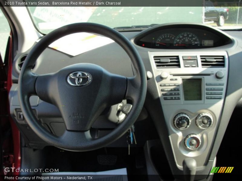 Barcelona Red Metallic / Dark Charcoal 2010 Toyota Yaris Sedan