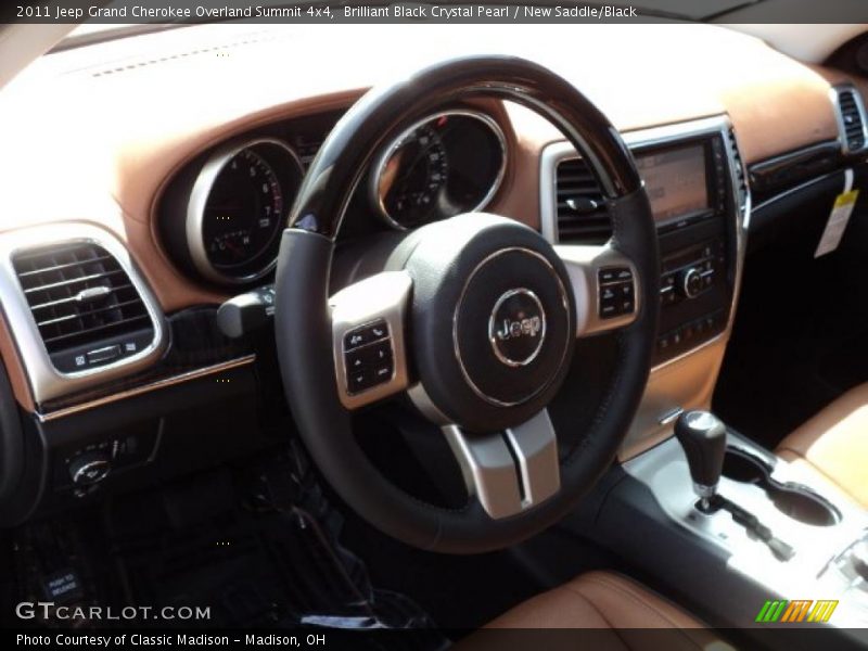 Brilliant Black Crystal Pearl / New Saddle/Black 2011 Jeep Grand Cherokee Overland Summit 4x4