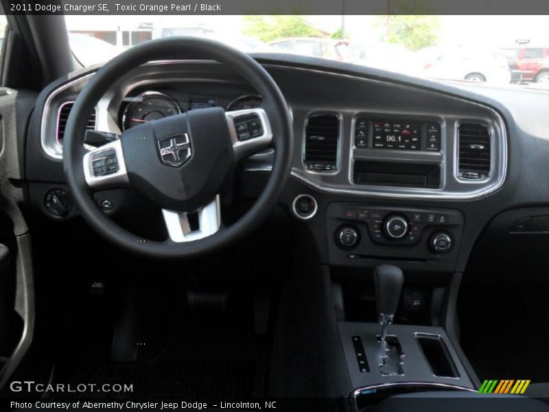 Toxic Orange Pearl / Black 2011 Dodge Charger SE
