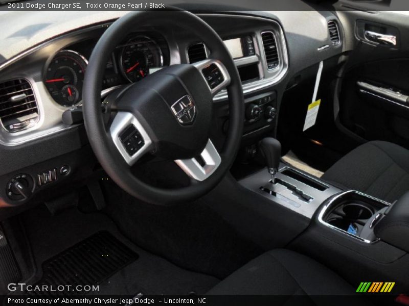 Toxic Orange Pearl / Black 2011 Dodge Charger SE