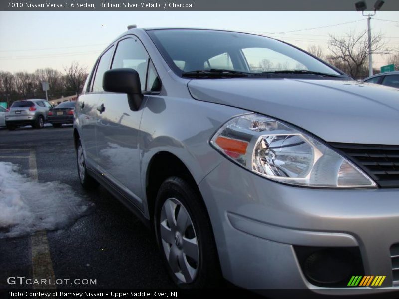 Brilliant Silver Metallic / Charcoal 2010 Nissan Versa 1.6 Sedan