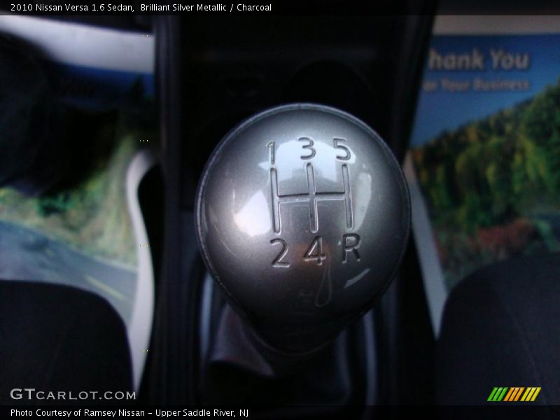 Brilliant Silver Metallic / Charcoal 2010 Nissan Versa 1.6 Sedan