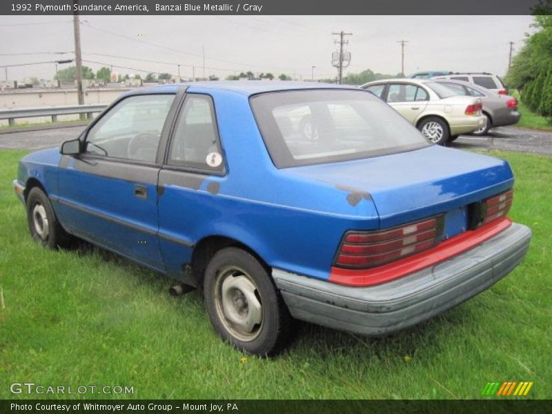 Banzai Blue Metallic / Gray 1992 Plymouth Sundance America