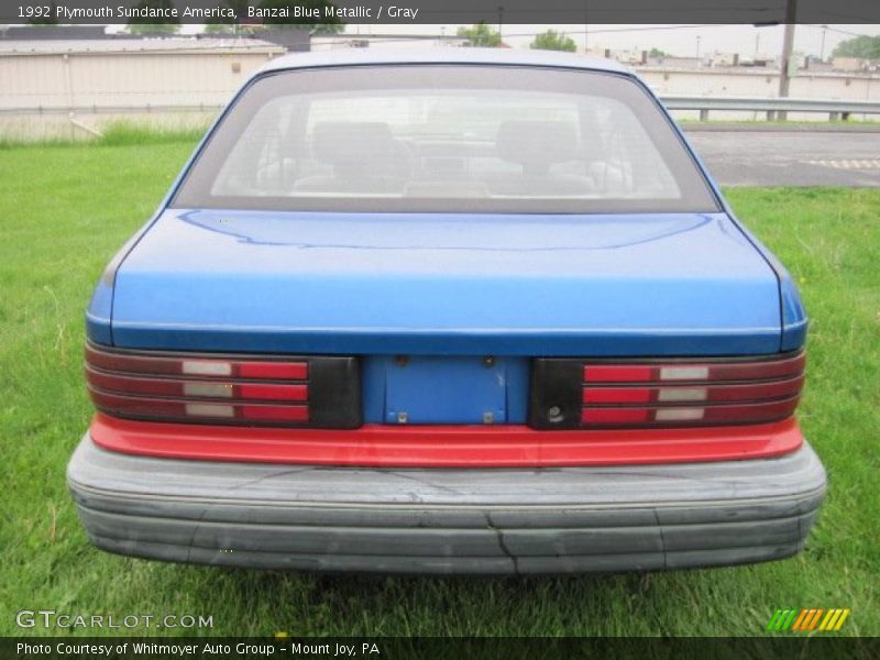 Banzai Blue Metallic / Gray 1992 Plymouth Sundance America