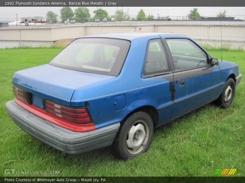 Banzai Blue Metallic / Gray 1992 Plymouth Sundance America