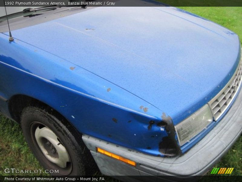 Banzai Blue Metallic / Gray 1992 Plymouth Sundance America