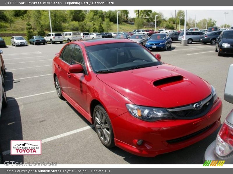 Lightning Red / Carbon Black 2010 Subaru Impreza WRX Sedan