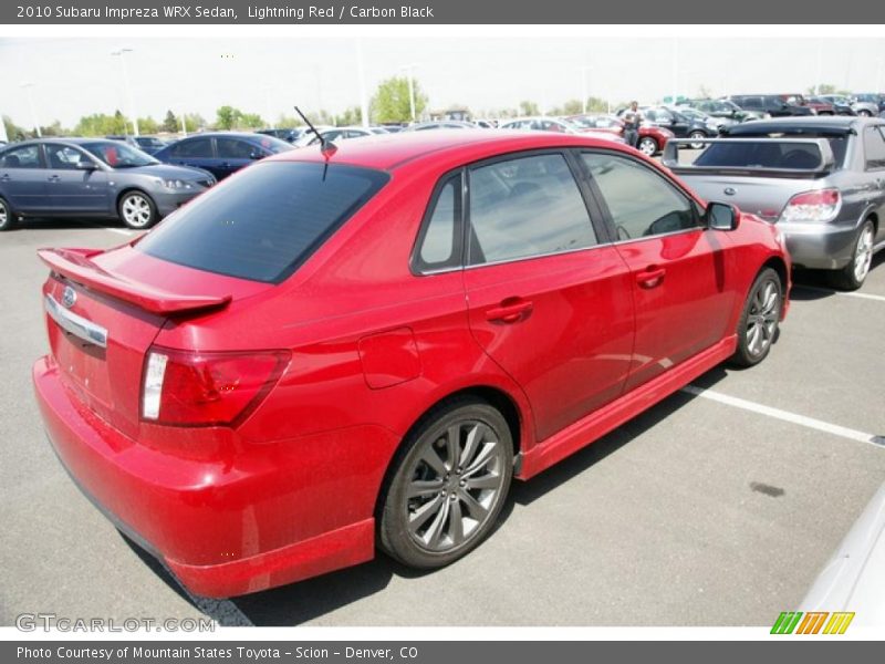 Lightning Red / Carbon Black 2010 Subaru Impreza WRX Sedan