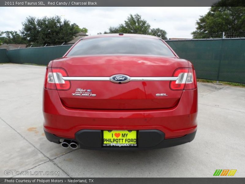 Red Candy / Charcoal Black 2011 Ford Taurus SEL