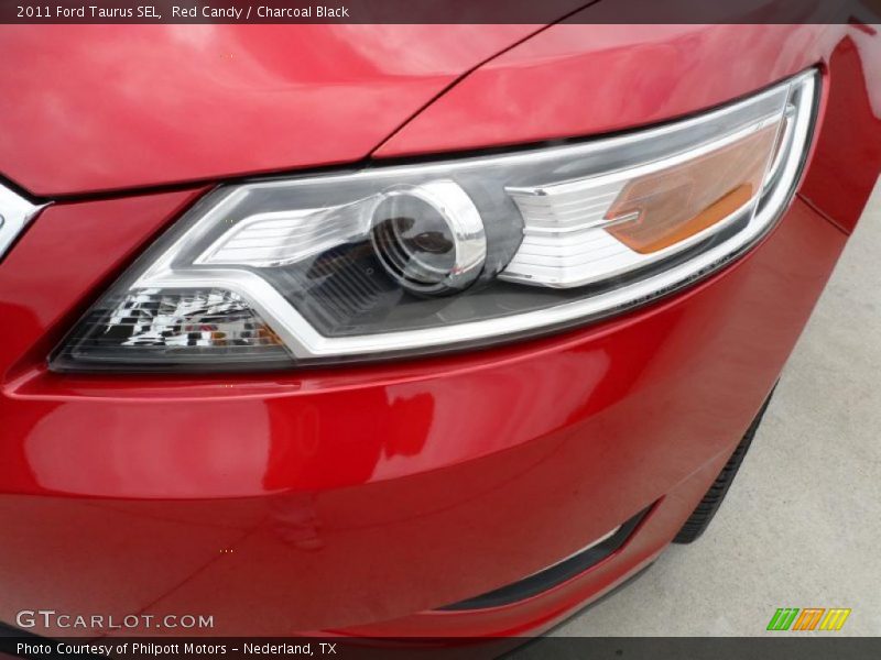 Red Candy / Charcoal Black 2011 Ford Taurus SEL