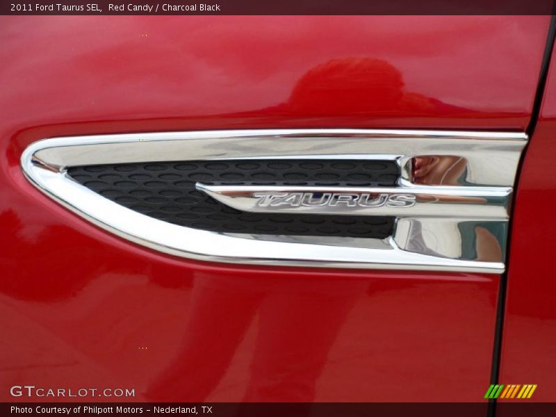 Red Candy / Charcoal Black 2011 Ford Taurus SEL