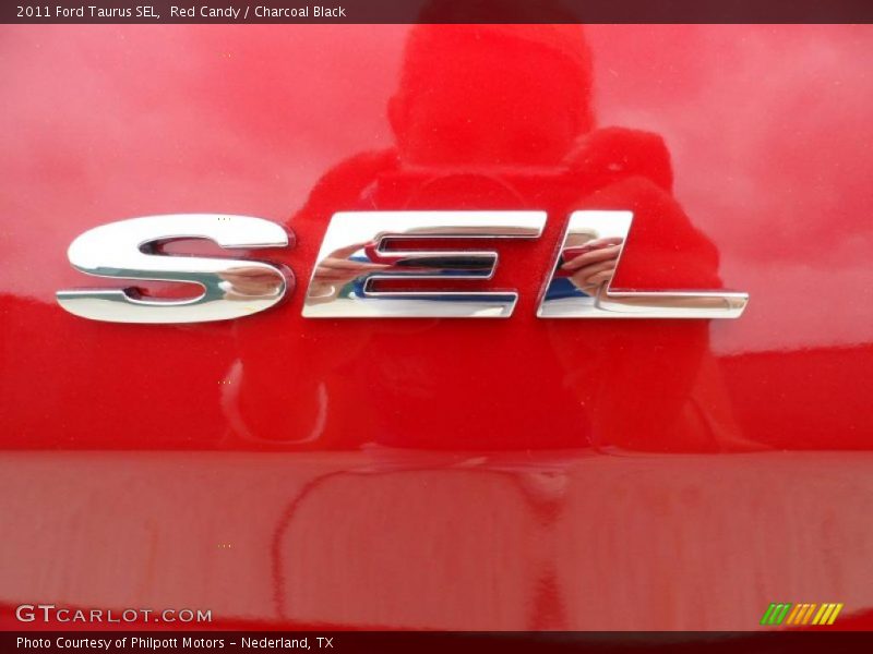 Red Candy / Charcoal Black 2011 Ford Taurus SEL