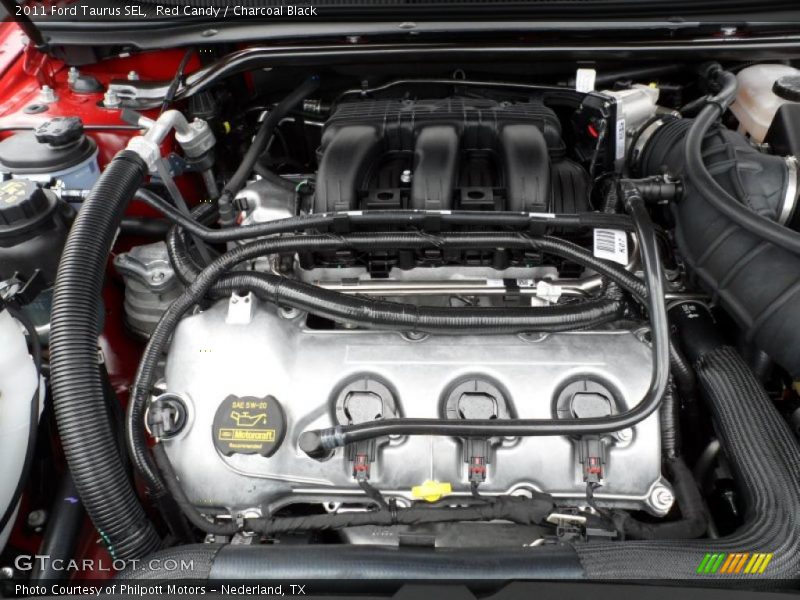 Red Candy / Charcoal Black 2011 Ford Taurus SEL