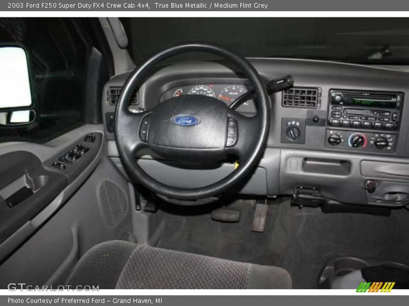 True Blue Metallic / Medium Flint Grey 2003 Ford F250 Super Duty FX4 Crew Cab 4x4