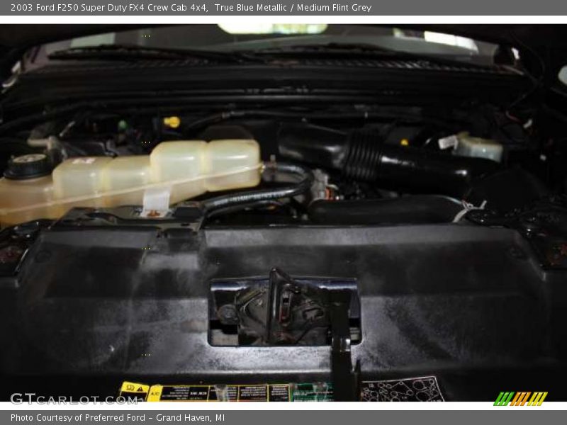 True Blue Metallic / Medium Flint Grey 2003 Ford F250 Super Duty FX4 Crew Cab 4x4