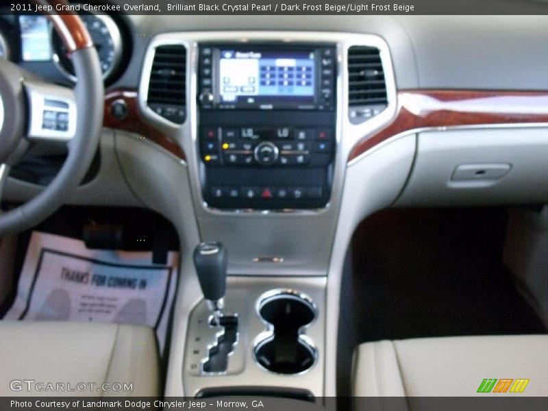 Brilliant Black Crystal Pearl / Dark Frost Beige/Light Frost Beige 2011 Jeep Grand Cherokee Overland