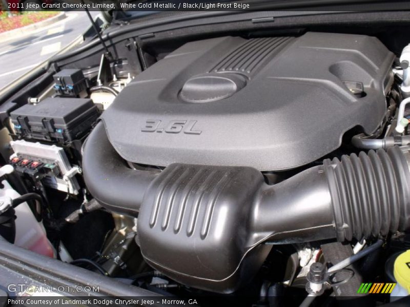 White Gold Metallic / Black/Light Frost Beige 2011 Jeep Grand Cherokee Limited