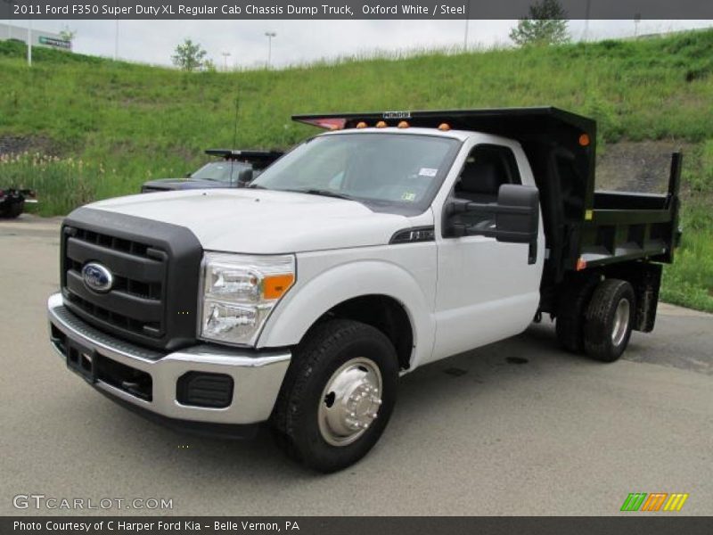 Front 3/4 View of 2011 F350 Super Duty XL Regular Cab Chassis Dump Truck