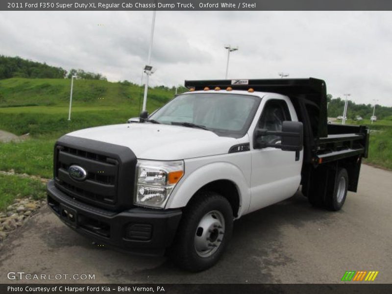 Front 3/4 View of 2011 F350 Super Duty XL Regular Cab Chassis Dump Truck