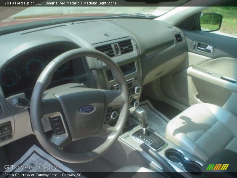 Sangria Red Metallic / Medium Light Stone 2010 Ford Fusion SEL