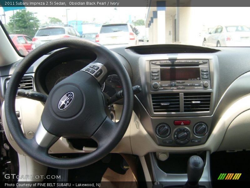 Obsidian Black Pearl / Ivory 2011 Subaru Impreza 2.5i Sedan