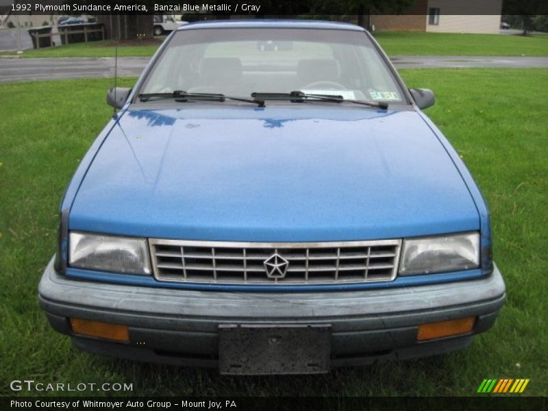 Banzai Blue Metallic / Gray 1992 Plymouth Sundance America