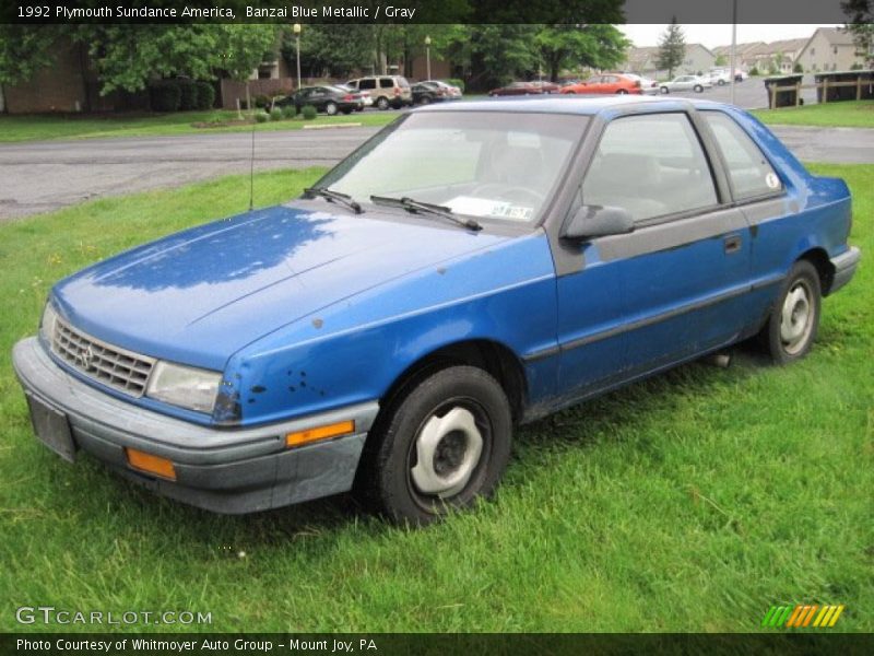 Banzai Blue Metallic / Gray 1992 Plymouth Sundance America