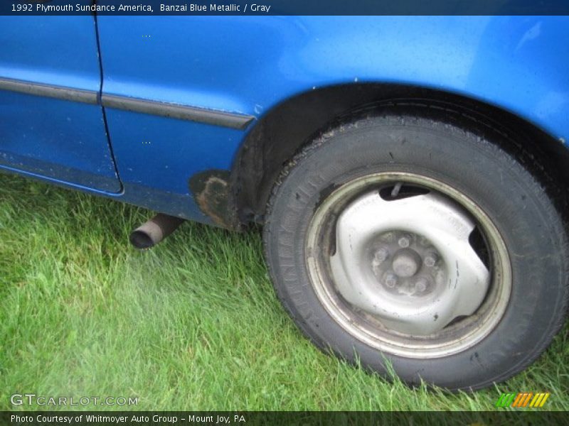 Banzai Blue Metallic / Gray 1992 Plymouth Sundance America