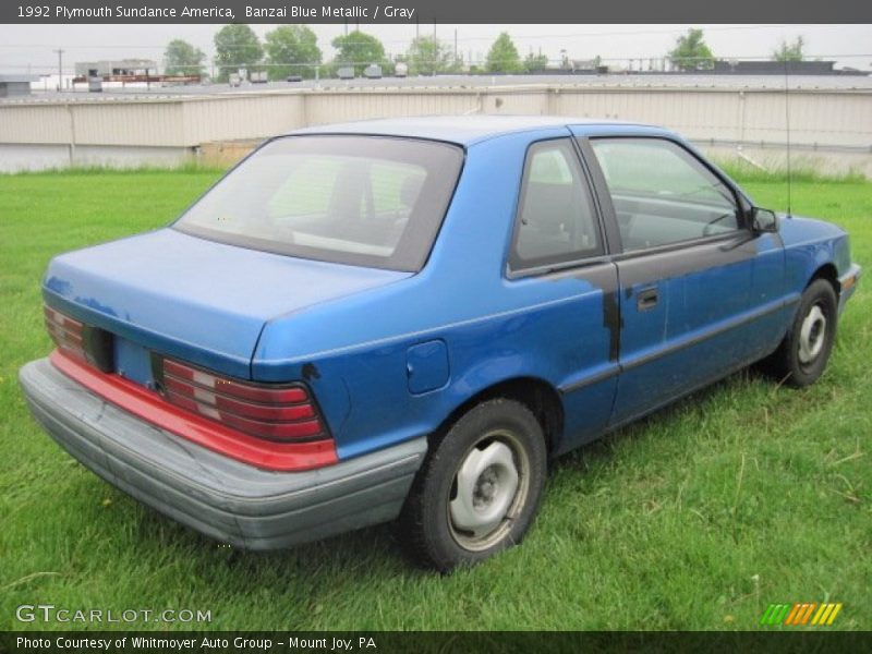 Banzai Blue Metallic / Gray 1992 Plymouth Sundance America