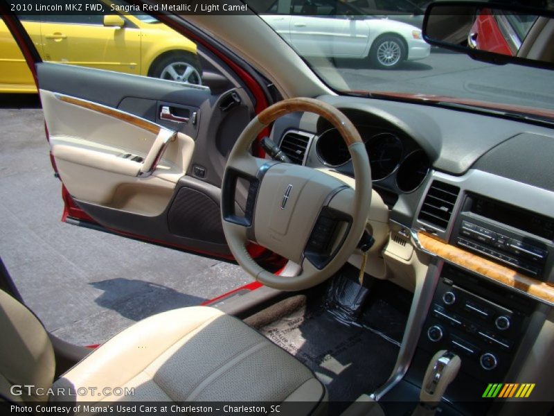 Sangria Red Metallic / Light Camel 2010 Lincoln MKZ FWD