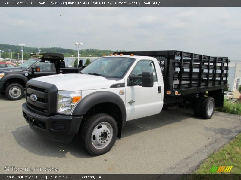 Front 3/4 View of 2011 F550 Super Duty XL Regular Cab 4x4 Stake Truck