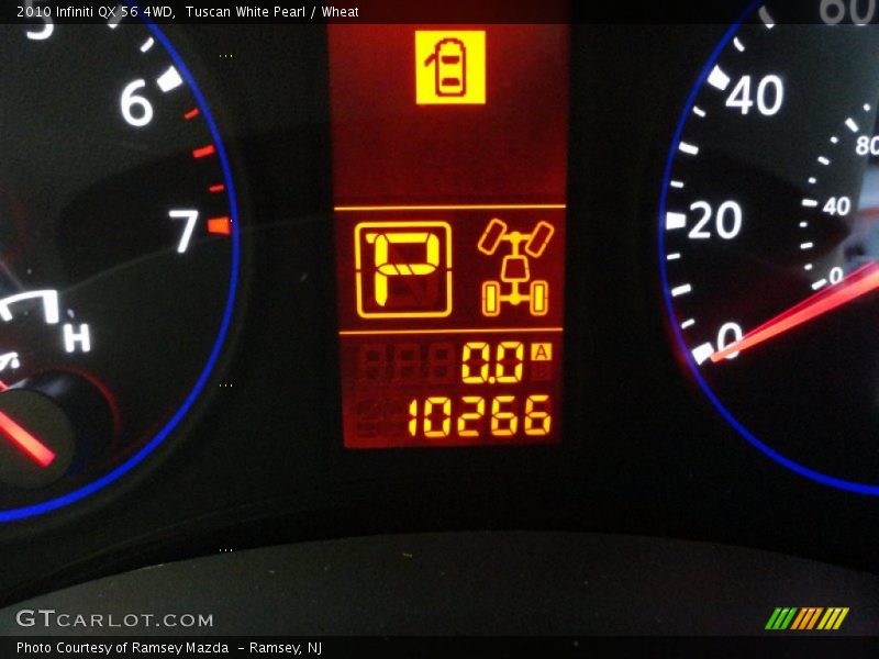 Tuscan White Pearl / Wheat 2010 Infiniti QX 56 4WD