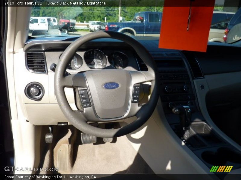 Tuxedo Black Metallic / Light Stone 2010 Ford Taurus SE