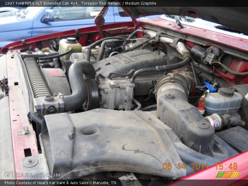Toreador Red Metallic / Medium Graphite 1997 Ford F250 XLT Extended Cab 4x4