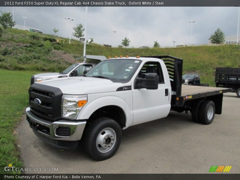 Front 3/4 View of 2011 F350 Super Duty XL Regular Cab 4x4 Chassis Stake Truck