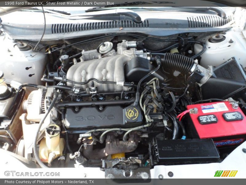Silver Frost Metallic / Dark Denim Blue 1998 Ford Taurus LX