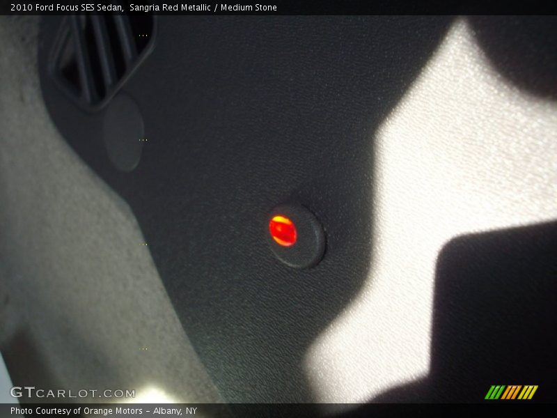 Sangria Red Metallic / Medium Stone 2010 Ford Focus SES Sedan