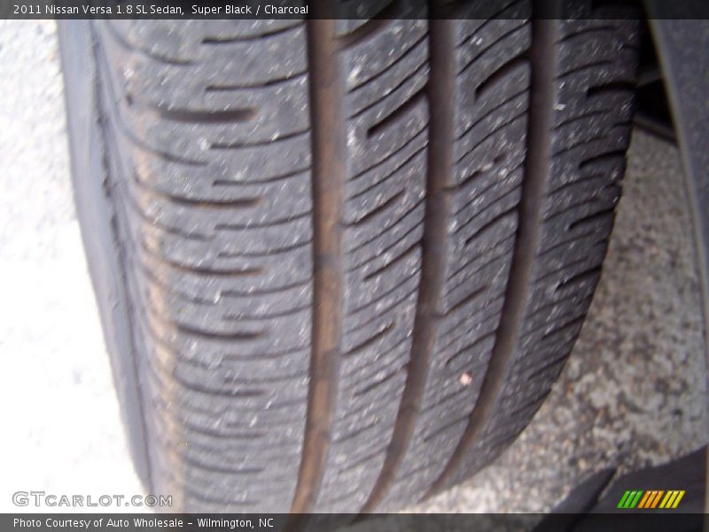 Super Black / Charcoal 2011 Nissan Versa 1.8 SL Sedan