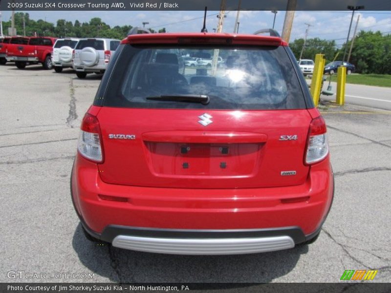 Vivid Red / Black 2009 Suzuki SX4 Crossover Touring AWD