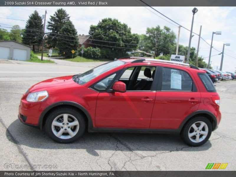 Vivid Red / Black 2009 Suzuki SX4 Crossover Touring AWD